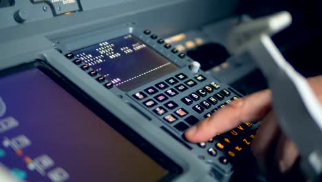 A-pilot-dials-on-a-dashboard,-close-up.