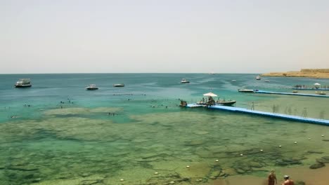 Visitors-to-the-resort-have-fun-on-the-shores-of-the-Red-Sea.-Single-frame-shooting,-time-lapse