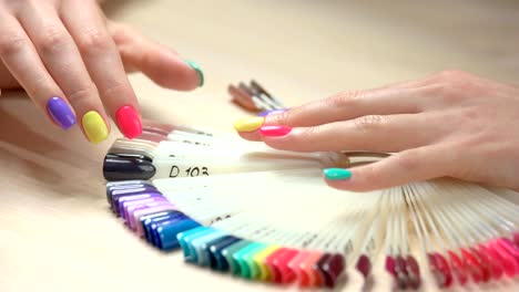 Young-woman-hands-and-nails-polish-palette.