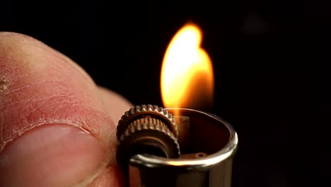 A-lighter-ignited-and-its-flame-shot-in-super-slow-motion