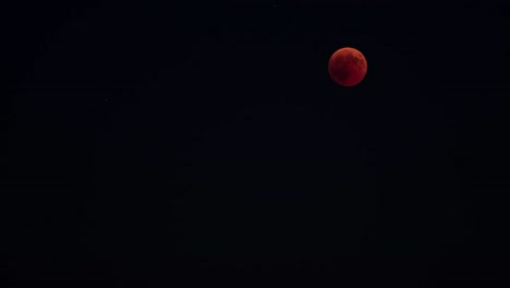 Lunar-eclipse-time-lapse-red-full-moon-from-shadow-to-bright,-outstanding-event-occurred-on-july-27,-2018