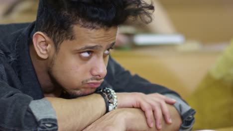 Sleepy-Male-Students-Lying-on-Desk