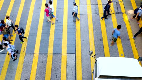 Busy-pedestrian-and-car-crossing-at-Mong-Kok---time-lapse