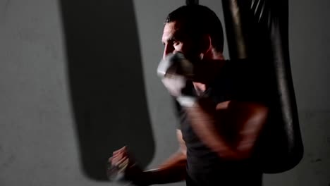 Male-bearded-boxer-exercising-shadow-boxing.