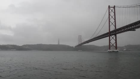 25-April-Bridge-and-Christ-the-King,-Lisbon,-Portugal