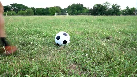 Football-players-play-football-at-the-grass.