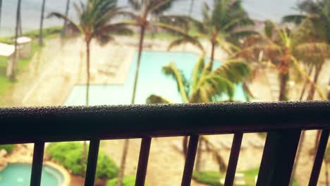 Looking-Out-Over-Hotel-Handrail-During-Storm