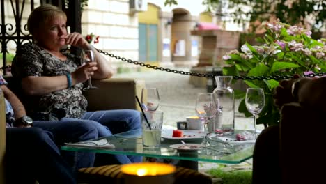 People-drinking-wine-in-street-cafe