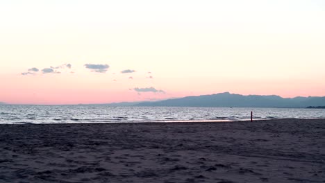 Twilight-over-the-mediterranean-sea-in-Costa-Daurada,-Spain.-Zooming-and-blending-real-time-and-timelapse