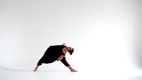 Man-practicing-intense-yoga-asana