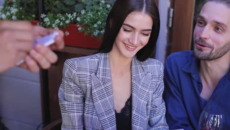 Couple-At-Restaurant.-People-With-Menu-Making-Order-At-Cafe