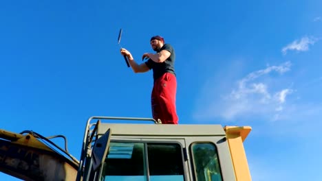 Martial-Art-Nunchaku-training-on-a-backhoe-3-FDV