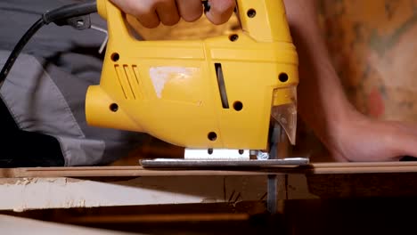 Man-working-with-jig-saw
