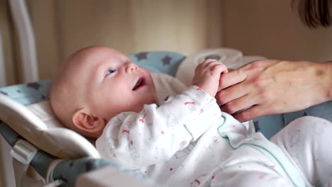 Mother-Playing-with-Baby-on-a-Baby-Rocking-Chair