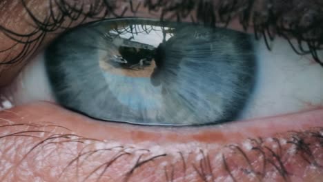 Extreme-Close-Up-of-a-Blue-Female-Eye-Blinking