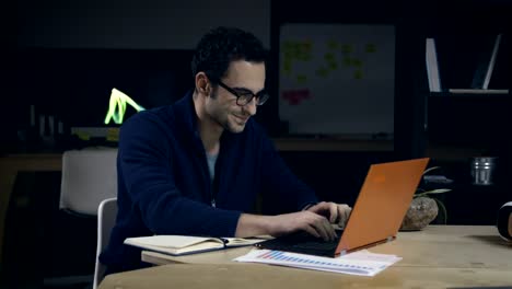 Creative-man-in-glasses-working-late-at-night