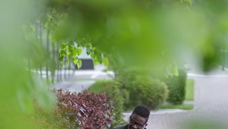 African-Businessman-Smiling-and-Chatting-via-Video-Call-Outdoors