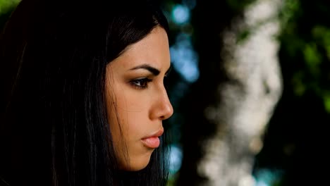 pensive-and-sad-Asian-woman's-profile---outdoor