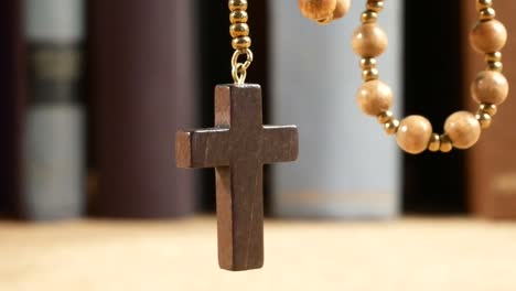 Wooden-Rosary-Hanging-in-Front-of-Library.-Panning.