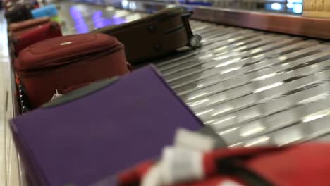 Baggage-conveyor-belt-in--Airport-carrying-the-passenger-luggage.-Thailand