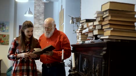 Mature-man-invites-granddaughter-to-read-the-book-together