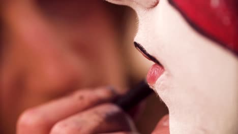 The-makeup-artist-applying-black-color-on-the-lips
