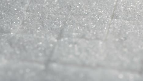 Table-top-shot-Group-of-Sugar-cubes-vary-position-on-light-blue-background