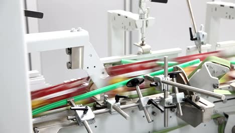 Fast-moving-products-inside-factory-production-line.-Automatic-conveyor-line