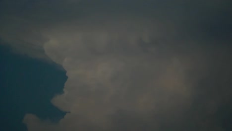 An-aircraft-passes-in-front-of-gigantic-cumulonimbus