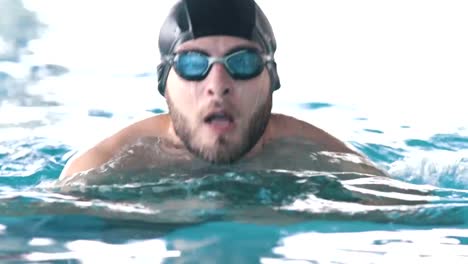 Disabled-man-swims-in-a-swimming-pool-towards-the-camera