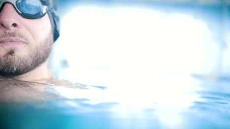 Handsome-bearded-man-in-a-swimming-pool.