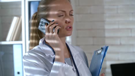 Female-Doctor-Talking-on-Phone