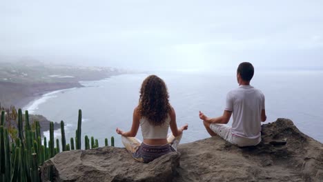 Two-man-man-and-a-woman-concept-of-healthy-living-in-the-mountains-on-an-island-with-the-Atlantic-ocean