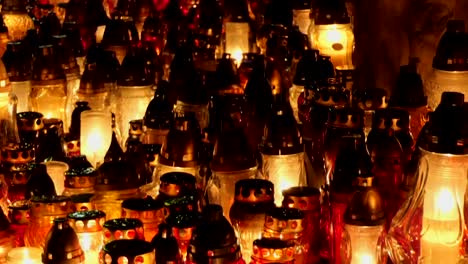 Grave-candles-on-cementery-in-the-night.-All-Saints-Day.