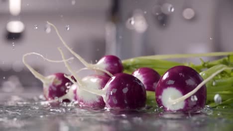 Falling-of-radish-into-the-wet-table.-Slow-motion-480-fps