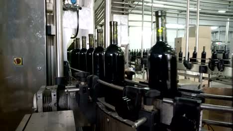 Bottling-and-sealing-conveyor-line-at-winery-factory