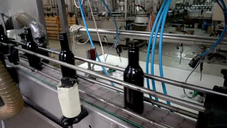 Bottling-and-sealing-conveyor-line-at-winery-factory