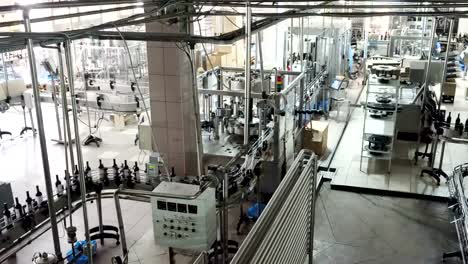 Bottling-and-sealing-conveyor-line-at-winery-factory