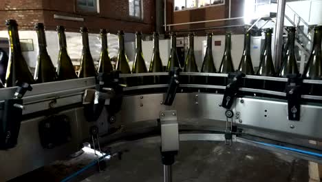 Bottling-and-sealing-conveyor-line-at-winery-factory