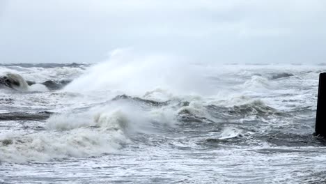 High-wave-breaking-on-the-rocks-of-the-coastline.-Extremely-Big-Wave-crushing-coast-,-Large-Ocean-Beautiful-Wave.-Super-Slow-Motion.