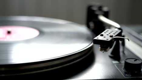 old-style-vinyl-tape-recorder-playing-spinning-plate-with-stylus-needle