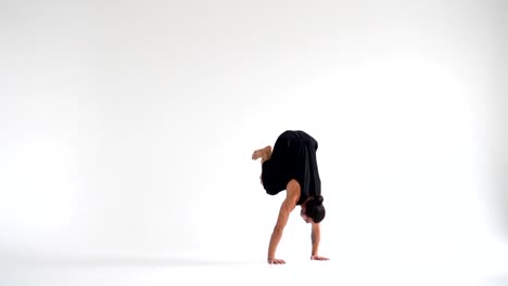 Man-practicing-intense-yoga-asana