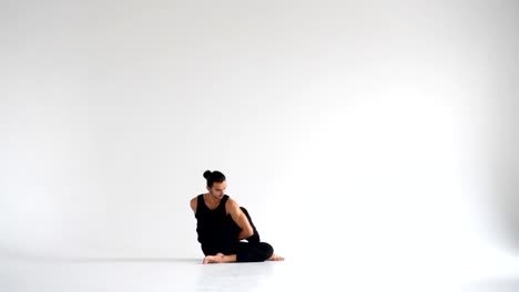 Man-practicing-intense-yoga-asana