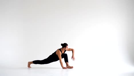 Man-practicing-intense-yoga-asana