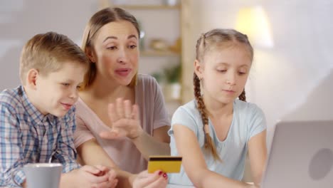 Mother-and-Children-Shopping-Online-with-Computer