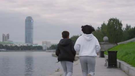 Mother-and-Son-Running-Along-Riverside-in-the-Morning