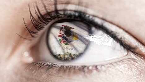 Woman-green-eye-in-close-up-with-the-flag-of-Illinois-state-in-iris,-united-states-of-america-with-wind-motion.-video-concept