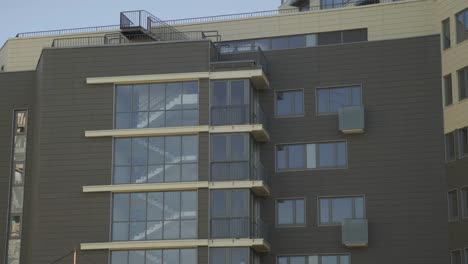 Residential-building-in-New-microdistrict.-Close-up-Of-An-Apartment-Blocks.-The-building-features-exterior-with-small-balconies