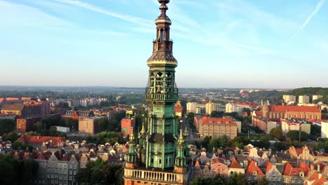 Gdansk-old-city-in-the-rays-of-the-rising-sun,-aerial-view-of-the-old-city-streets