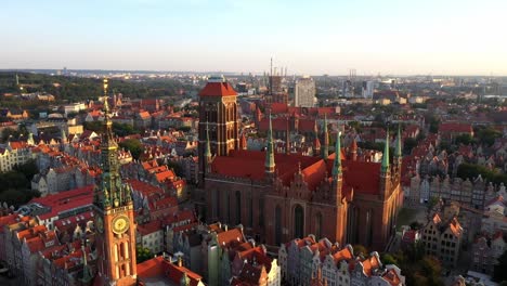 Gdansk-old-city-in-the-rays-of-the-rising-sun,-aerial-view-of-the-old-city-streets